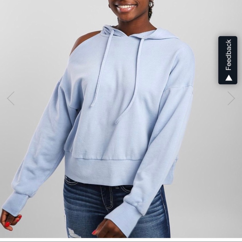 Distressed cold shoulder sweatshirt